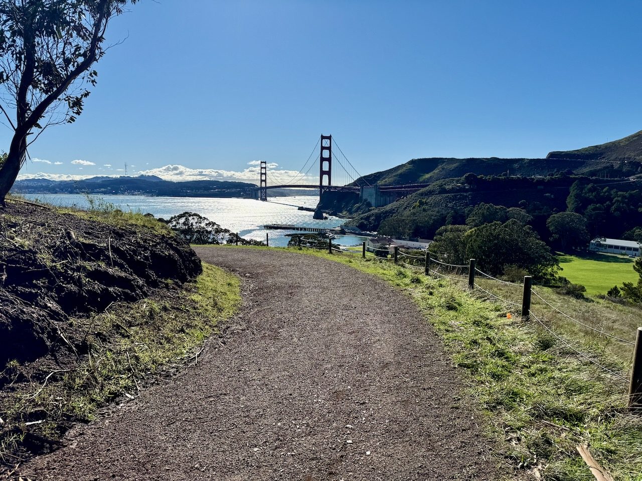 A gravel path descending toward the Golden Gate Bridge